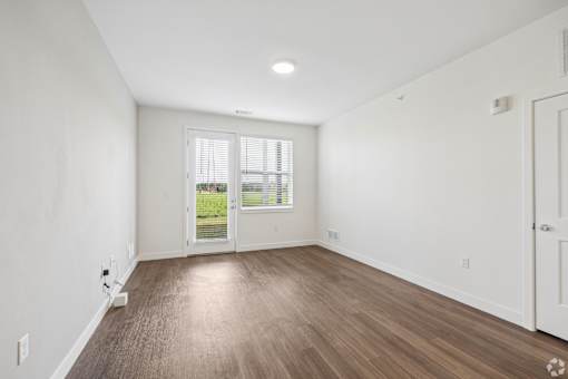 A room with a window and a door.