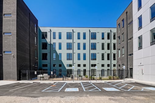 an empty parking lot in front of a building