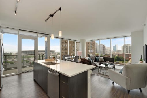a kitchen and living room with a view of the city