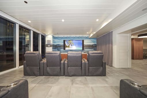 a large living room with a couch and a television