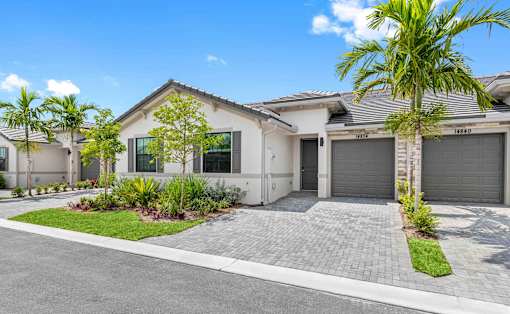 a house with a driveway and a garage door