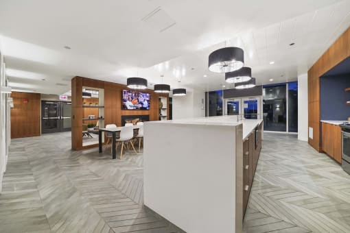 a view of a kitchen and dining area with a tv