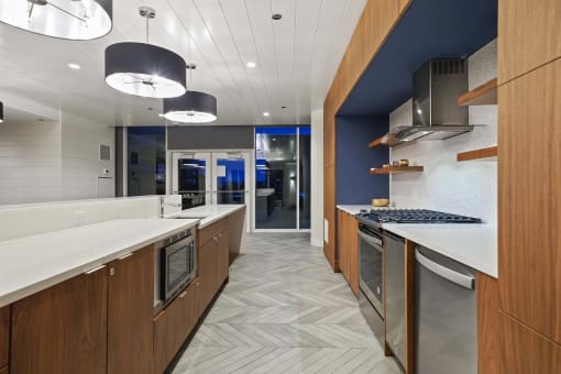 a kitchen with a long counter top and a sink
