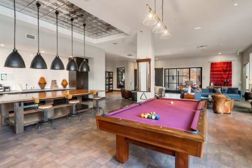 Germantown Nashville Luxury Apartments for Rent - Peyton Stakes - Clubhouse with Billiards Table, Kitchen Area, and Floor-to-Ceiling Windows