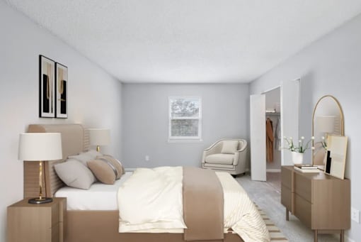 A bedroom with a bed, nightstand, and chair.