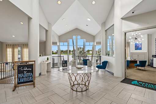 A spacious lobby with a marble floor and a sign that reads "Welcome to Marlton Landing.".