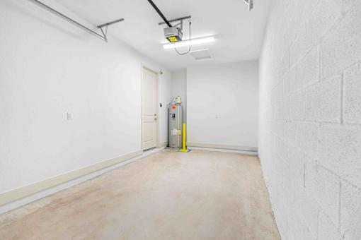a empty room with a white wall and a white door