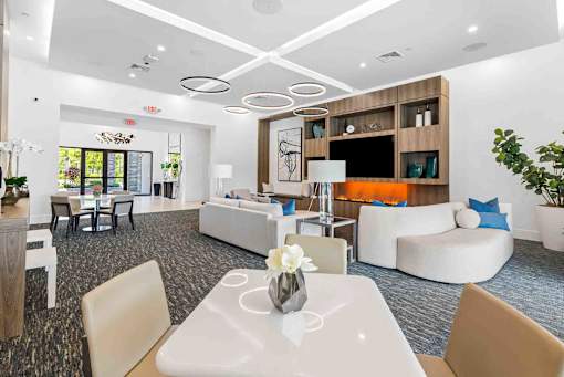 a living room with couches and chairs and a table