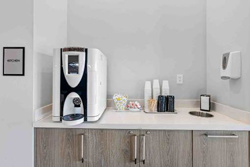 a coffee maker on a counter in a hotel room