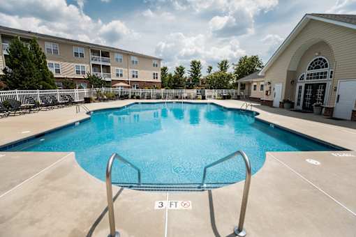A large swimming pool with a 3 feet depth sign.