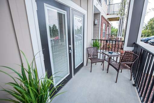 A patio with a table and chairs is shown.