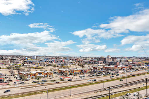 A cityscape with buildings and a highway.