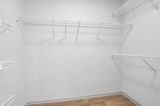 Empty white shelves in a room.