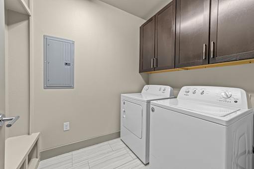 A laundry room with a washer and dryer.