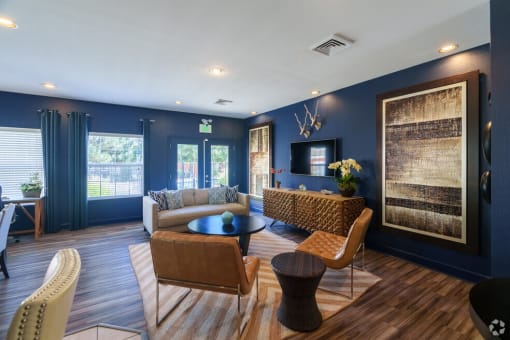 a living room with blue walls and a couch and a table