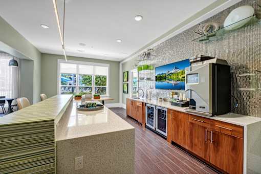 A kitchen with a counter and a microwave.