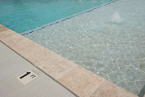 A pool with a number 1 on the floor.