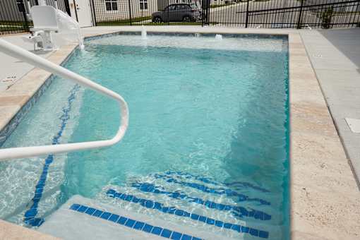 A small pool with a white ladder.