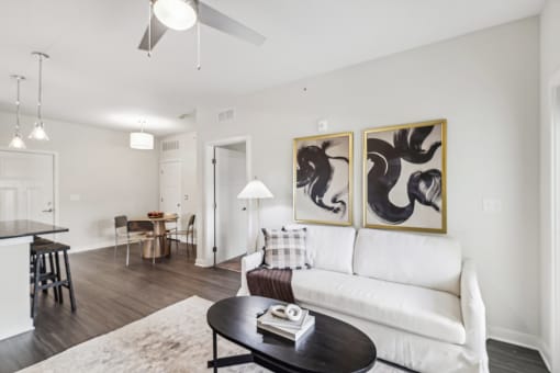 a living room with a white couch and a coffee table