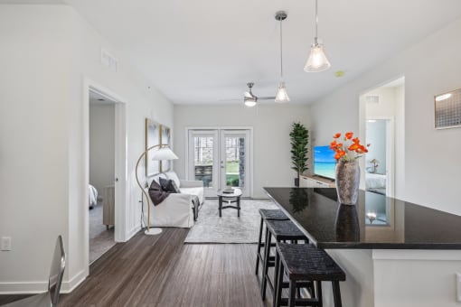 a living room with a kitchen and a dining room
