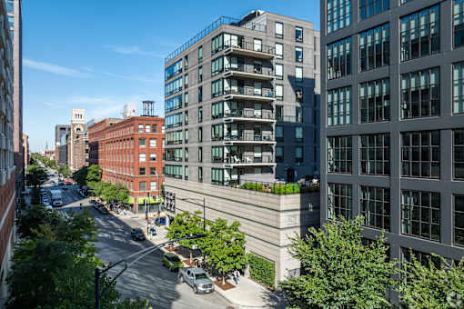 A city street with cars and buildings.