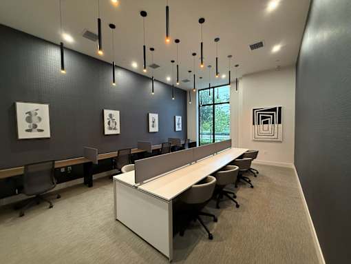 A conference room with a long table and chairs.