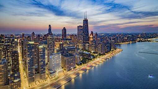 A cityscape with a river running through it.