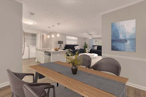 A modern kitchen with a dining table and chairs.