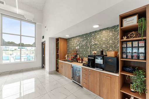 A modern kitchen with a counter and a window.