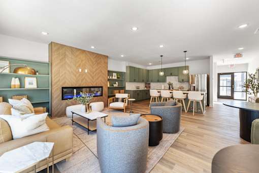 A modern living room with a wooden cabinet and a grey sofa.