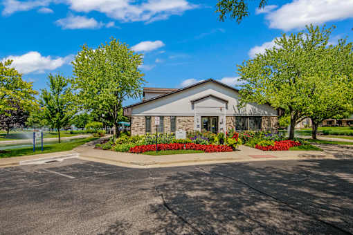 A building with a driveway in front of it.