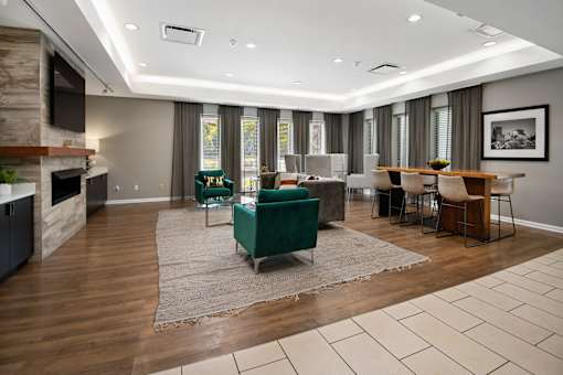 A modern living room with a fireplace and a dining area.