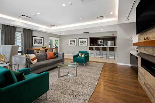 A living room with a green couch and a coffee table.