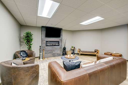 A living room with a fireplace and a couch.