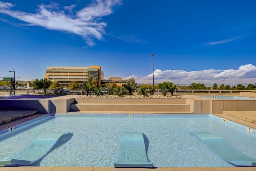 a pool with a building in the background