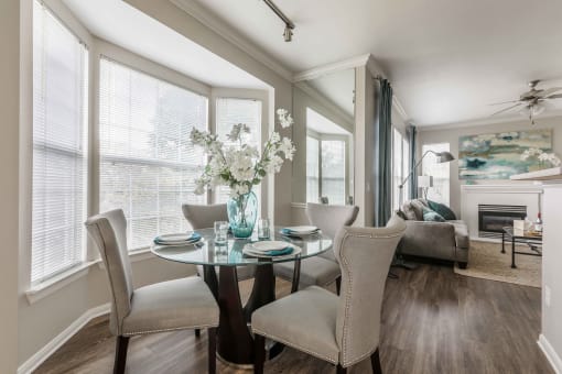 a dining room with a table and chairs