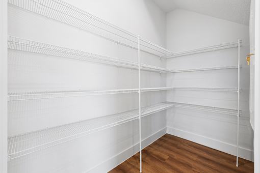 Empty white shelves in a room.