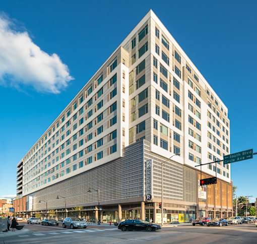 A large building with a flat roof and a lot of windows.