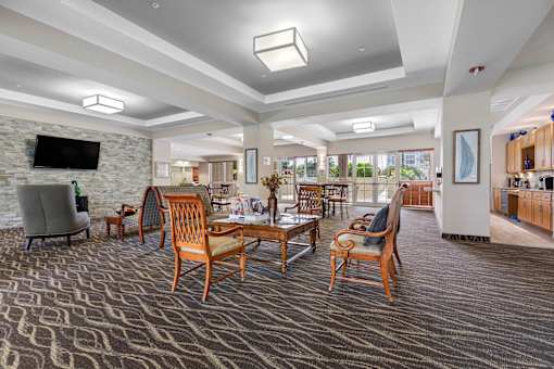 Gaming room with 4 top table seating and serving kitchen for events