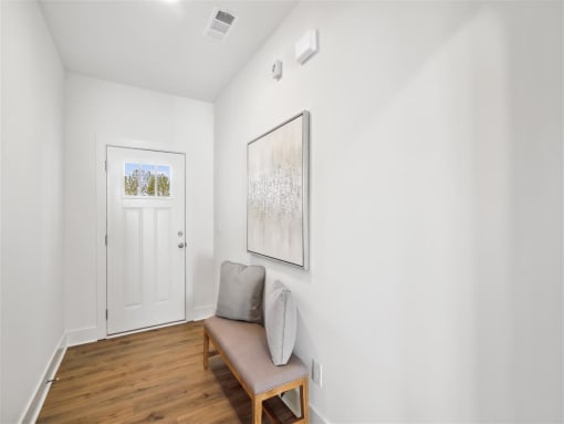 a living room with a couch and a door