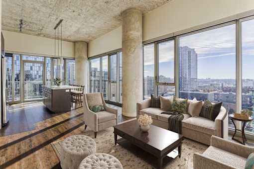 A living room with a view of the city.