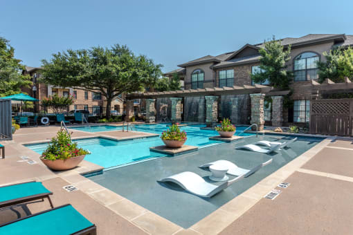 our apartments have a large swimming pool with lounge chairs