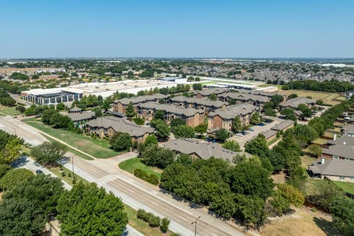 an aerial view of a suburban neighborhood with houses and trees