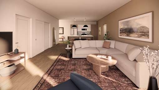 A living room with a white couch and a coffee table.