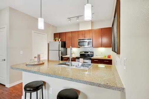 a kitchen with a counter top and a sink