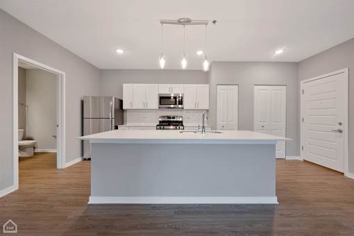 A modern kitchen with a large island in the middle.