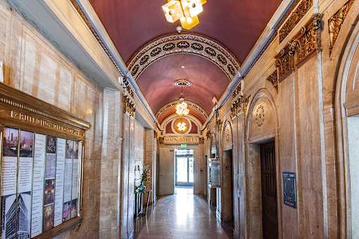 A long hallway with a red ceiling and a sign that says Main Street.