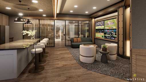 A modern bar with a row of stools and a television playing sports.