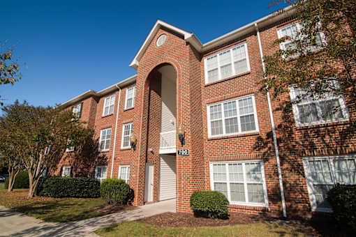 A red brick building with the number 700 on it.