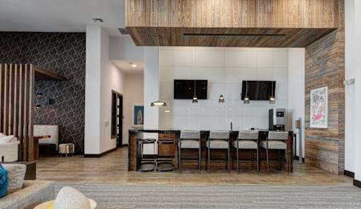 A modern kitchen with a dining table and chairs.